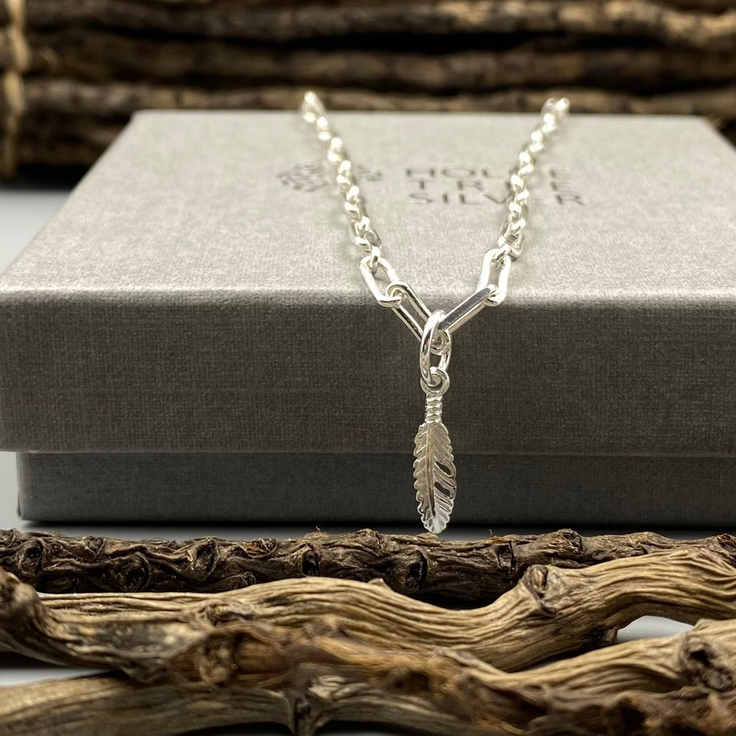 Feather charm trace chain necklace in Sterling Silver
