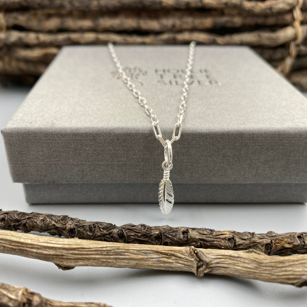 Feather charm skinny trace chain necklace in Sterling Silver