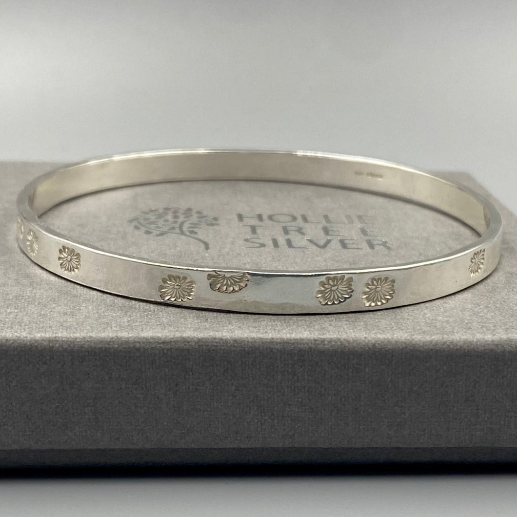 Chunky daisy stamped bangle in Sterling Silver - April Birthday