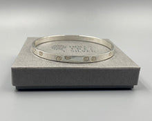 Load image into Gallery viewer, Chunky daisy stamped bangle in Sterling Silver - April Birthday
