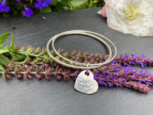 Load image into Gallery viewer, Sterling silver dimple texture double bangle with a heart charm
